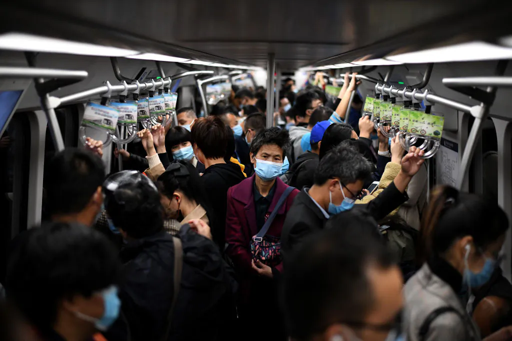 Passengers wearing masks ride the subway in Beijing on Oct. 23, 2020. (Noel Celis/AFP via Getty Images)
