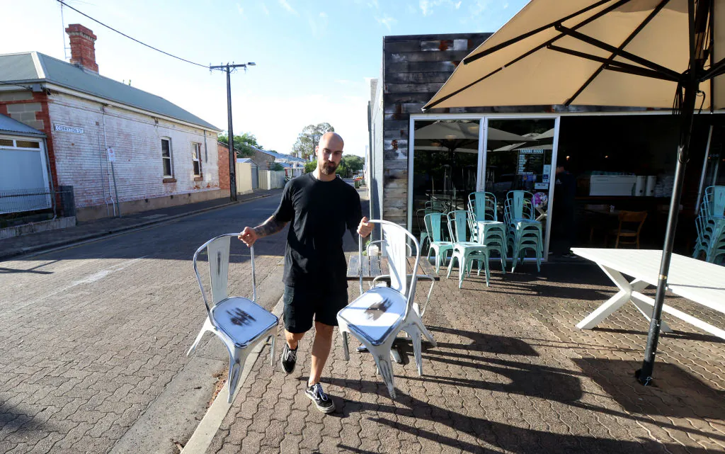 Mensur Delkic of Ballaboosta Cafe in Adelaide, Australia preparing to open after being in lockdown for 4 days on Nov. 22, 2020. (Kelly Barnes/Getty Images)