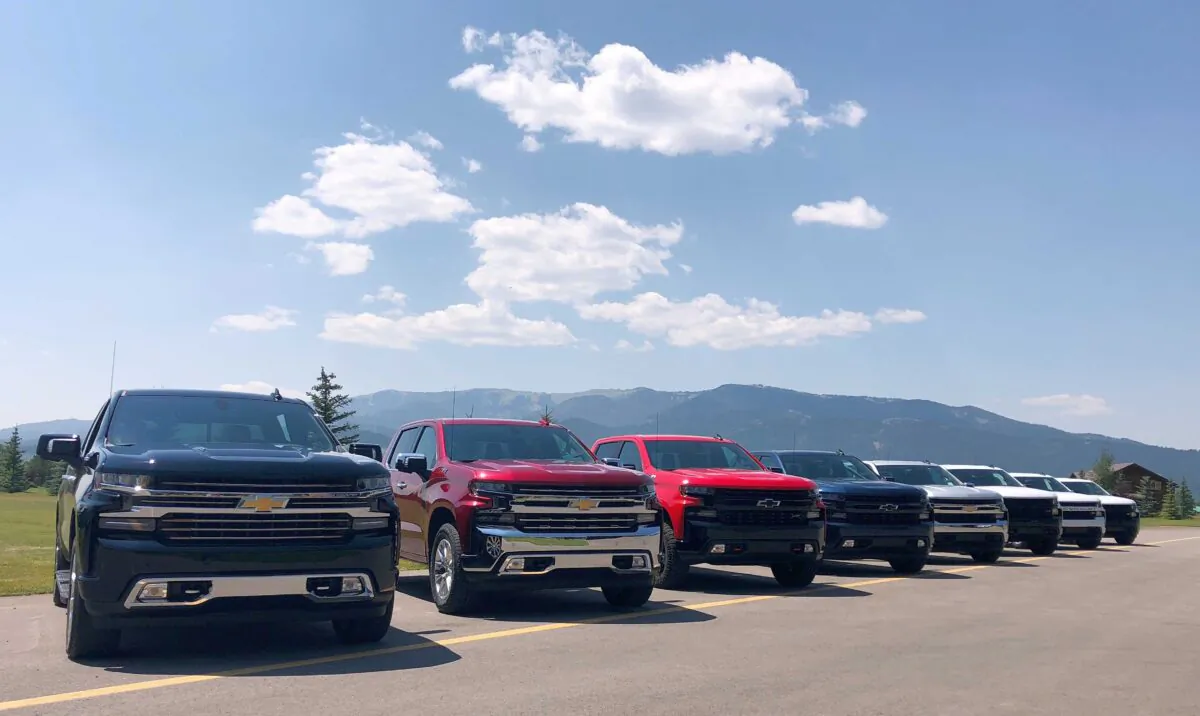 Eight versions of General Motors CO’s new generation Chevrolet Silverado pickups are pictured lined up at an event near Alpine, Idaho, on Aug. 7, 2018. (Joseph White/Reuters)