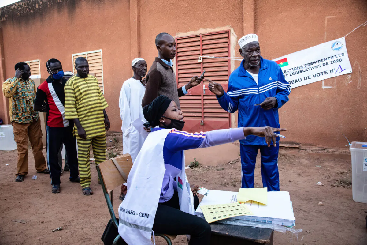 People line up to vote in Burkina Faso's presidential and legislative elections as polling stations open in Ouagadougou on Nov. 22, 2020. (Sophie Garcia/AP Photo)
