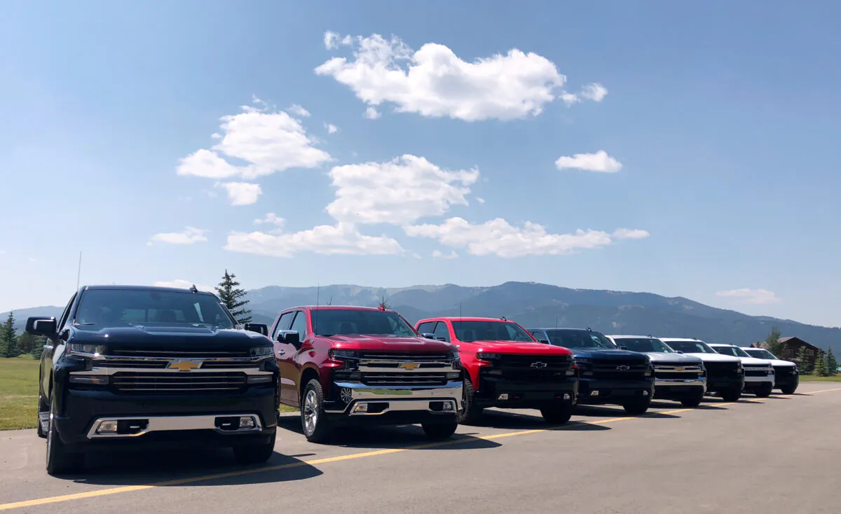 Eight versions of GM’s new generation Chevrolet Silverado pickups are lined up at an event near Alpine, Idaho, on Aug. 7, 2018. (Joseph White/Reuters)