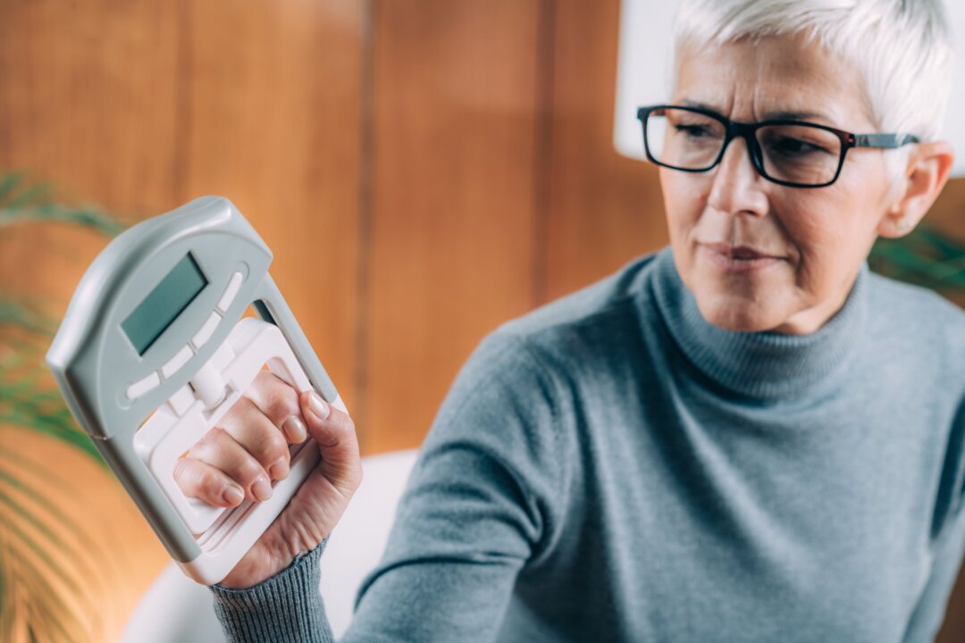Doctors will assess grip strength by asking a client to squeeze a dynamometer, a device that measure pounds per square inch.(Microgen/Shutterstock)