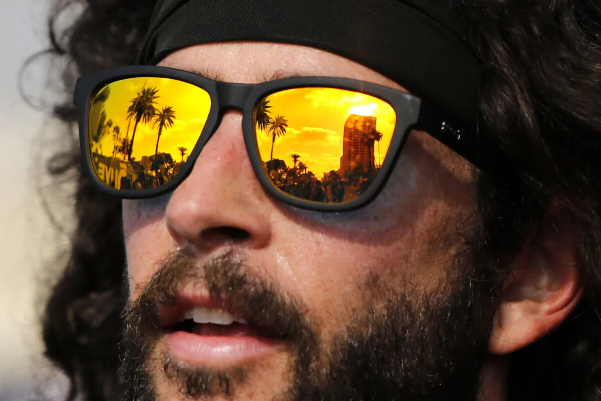 A reflection of palm trees in a runner's sunglasses following the finish of the 2019 Los Angeles Marathon  in Los Angeles on March 24, 2019. (Katharine Lotze/Getty Images)