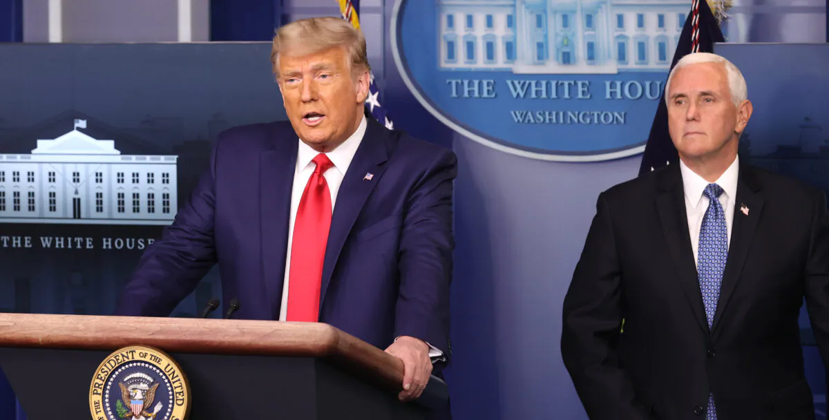 Then-President Donald Trump (L) speaks as Vice President Mike Pence (R) looks on in the James Brady Press Briefing Room at the White House on Nov. 24, 2020. (Chip Somodevilla/Getty Images)
