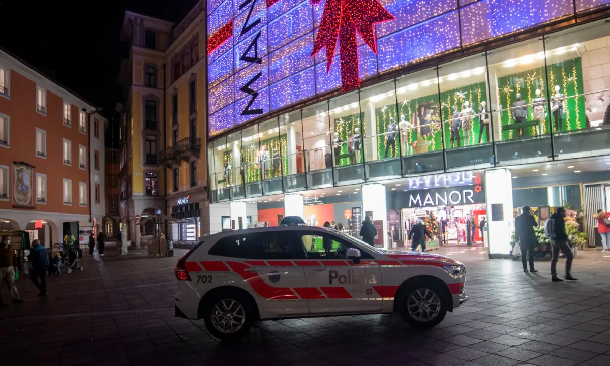 A police car in the area where a stabbing occurred in the department store, in Lugano, Switzerland, on Nov. 24, 2020. (Ti-Press/Keystone via AP)