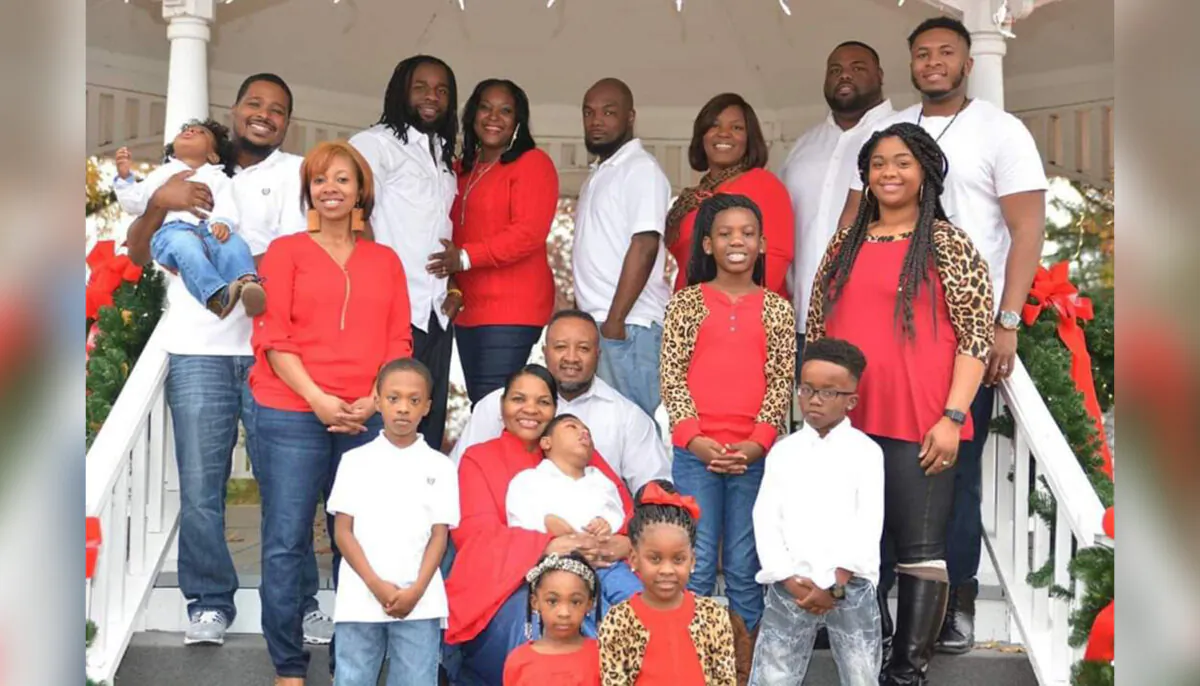 Willie and Teresa Smith​ (C) holding their adopted son, Kristopher. Also pictured are their five grandchildren and six adult children, three of whom are with their spouses. (Courtesy of Teresa Smith)