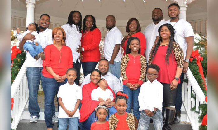 Willie and Teresa Smith​ (C) holding their adopted son, Kristopher. Also pictured are their five grandchildren and six adult children, three of whom are with their spouses. (Courtesy of Teresa Smith)