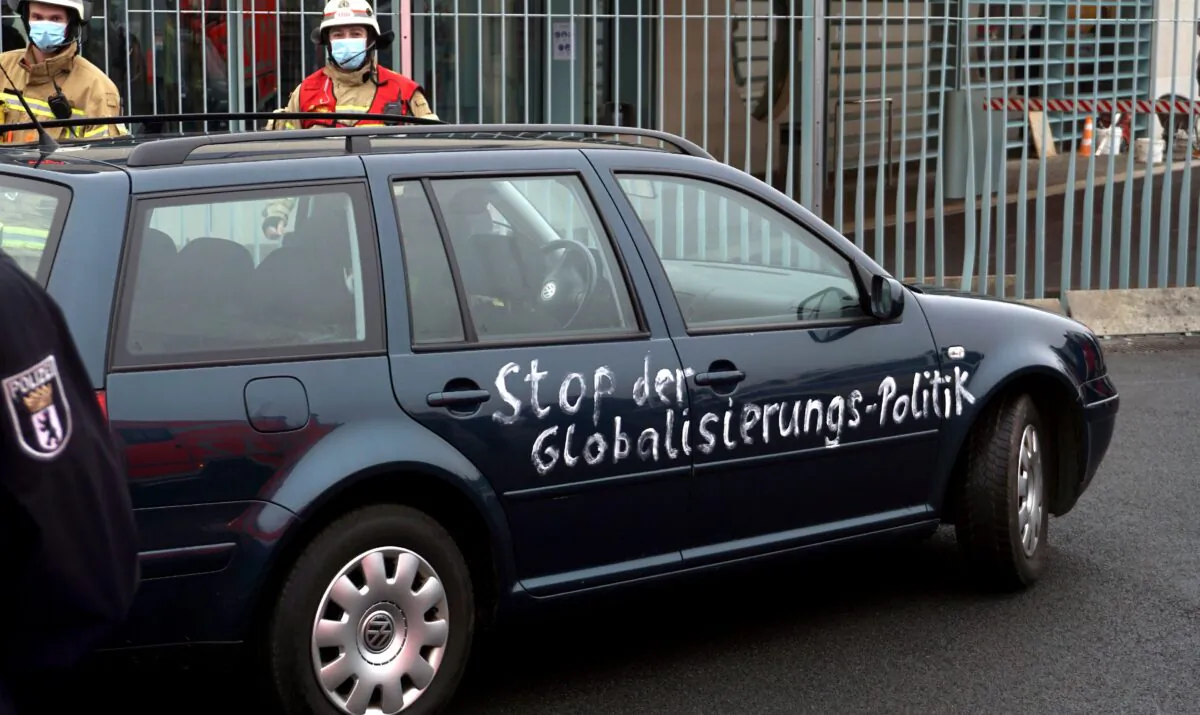 A car stands in front of the chancellery after it crashed into the front gate of the building housing German Chancellors Angela Merkel's offices in Berlin, on Nov. 25, 2020. (Michael Sohn/AP Photo)