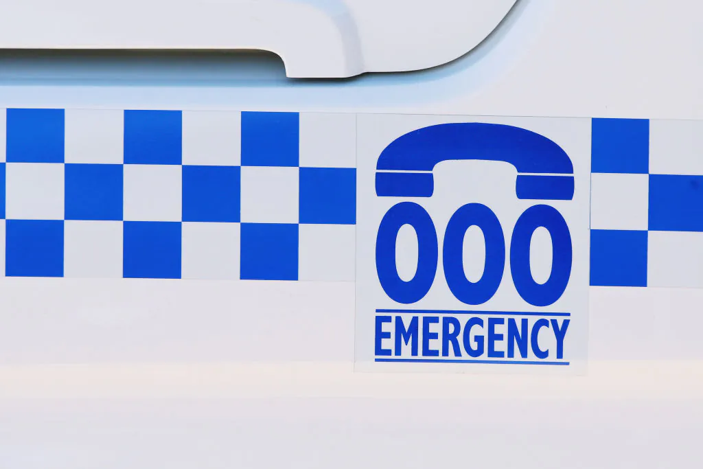 A general view of an emergency contact number on the side of a police car at Wagga Wagga Police Station in Wagga Wagga, Australia, on May 5, 2019. (Jenny Evans/Getty Images)