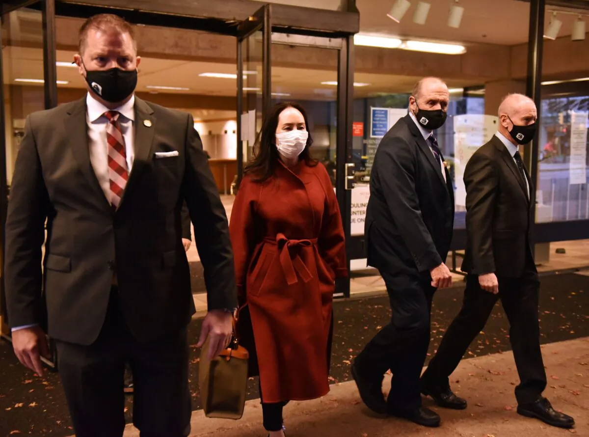 Huawei Chief Financial Officer, Meng Wanzhou, leaves British Columbia Supreme Court with her security team, in Vancouver, British Columbia, Canada, on Nov. 17, 2020. (Don Mackinnon/AFP via Getty Images)