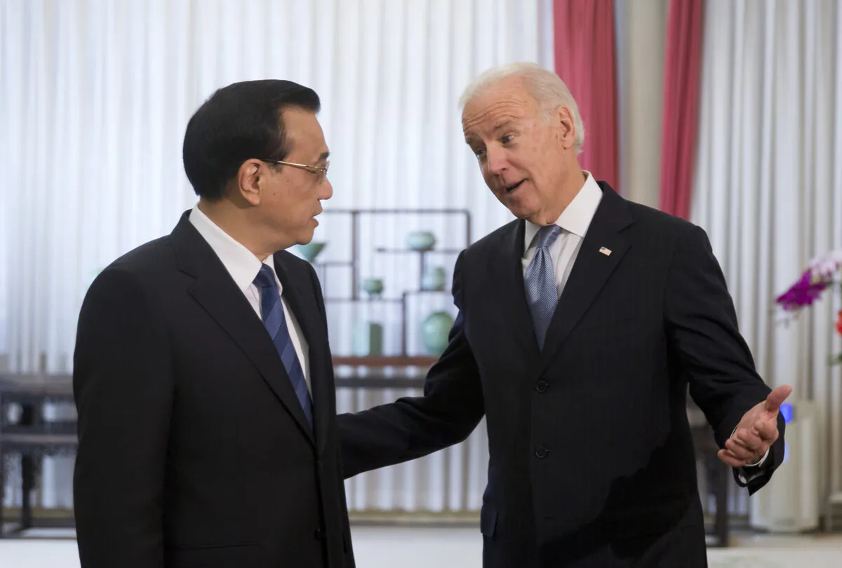 Former Vice President Joe Biden chats with Chinese Premier Li Keqiang at the Zhongnanhai diplomatic compound in Beijing, China on Dec. 5, 2013. (ANDY WONG/AFP via Getty Images)