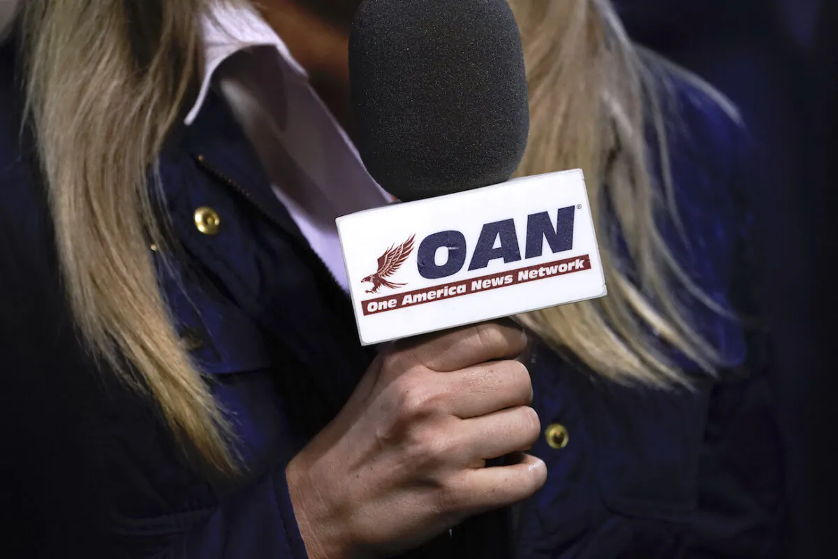 A reporter with One America News Network at a campaign rally with President Donald Trump at Williamsburg International Airport in Newport News, Va., on Sept. 25, 2020. (Drew Angerer/Getty Images)