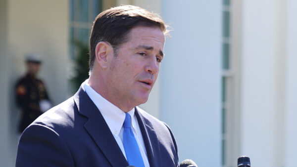 Arizona Governor Doug Ducey talks to reporters
