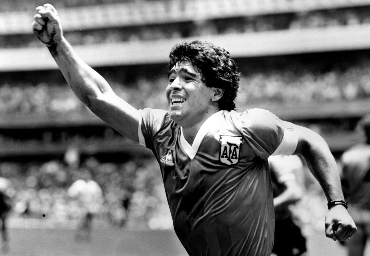 Argentinian star Diego Maradona raises his arm in the air after scoring his game winning goal against England in their World Cup semi final in Mexico on June 22, 1986. (Ted Blackbrow/Pool/File Photo/Reuters)