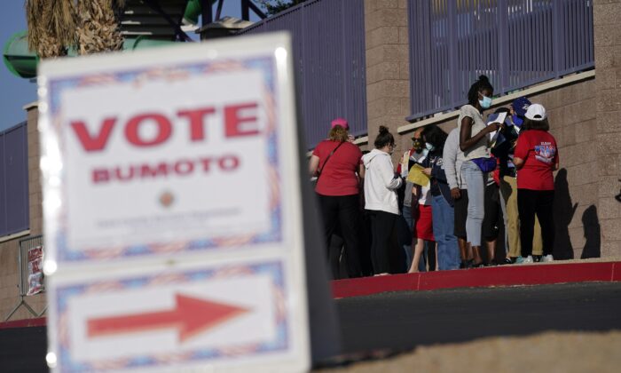 People wait in line to vote at a polling place on Election Day in Las Vegas, on Nov. 3, 2020. (John Locher/AP Photo)