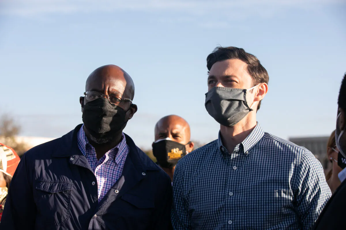 Democratic U.S. Senate candidates Jon Ossoff, right, and Raphael Warnock campaign in Marietta, Ga., on Nov. 15, 2020. (Jessica McGowan/Getty Images)