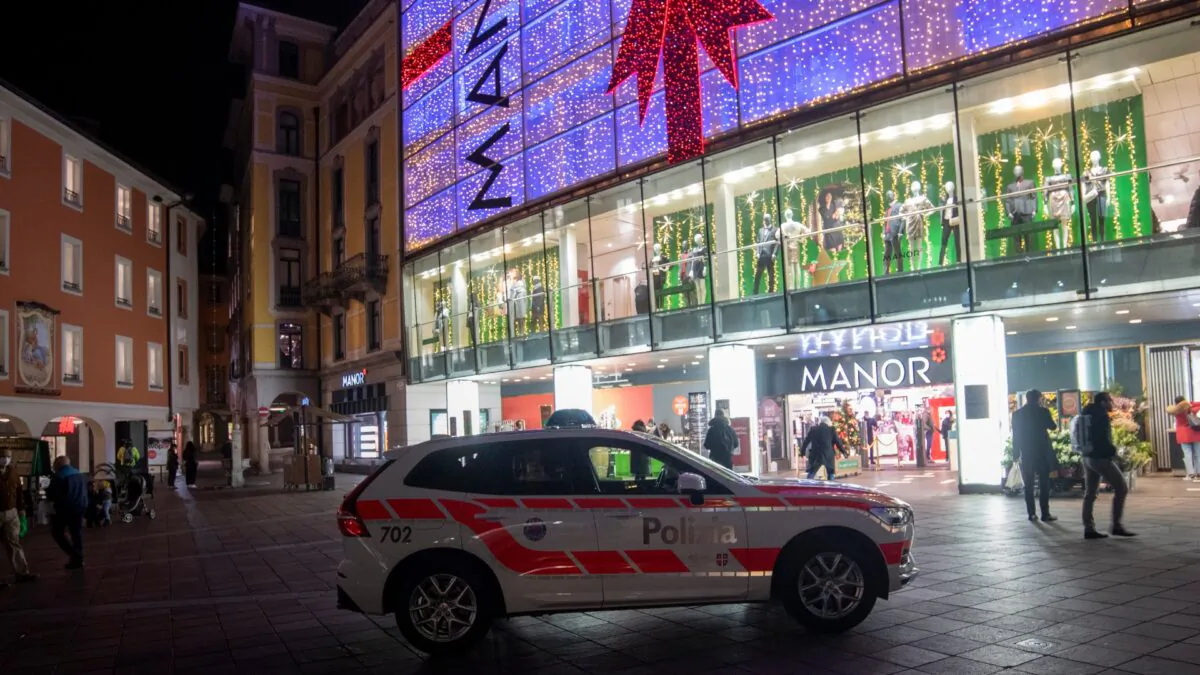 A police car in the area where a stabbing occurred in the department store, in Lugano, Switzerland, on Nov. 24, 2020. (Ti-Press/Keystone via AP)