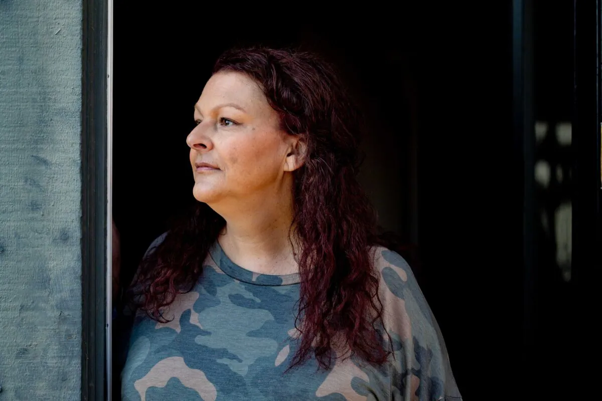Alexandra Dreyer, who is helping lead a local Buy Nothing Day initiative, stands in the doorway of a Coto de Caza, Calif. residence she is housesitting, on Nov. 25, 2020. (John Fredricks/The Epoch Times)