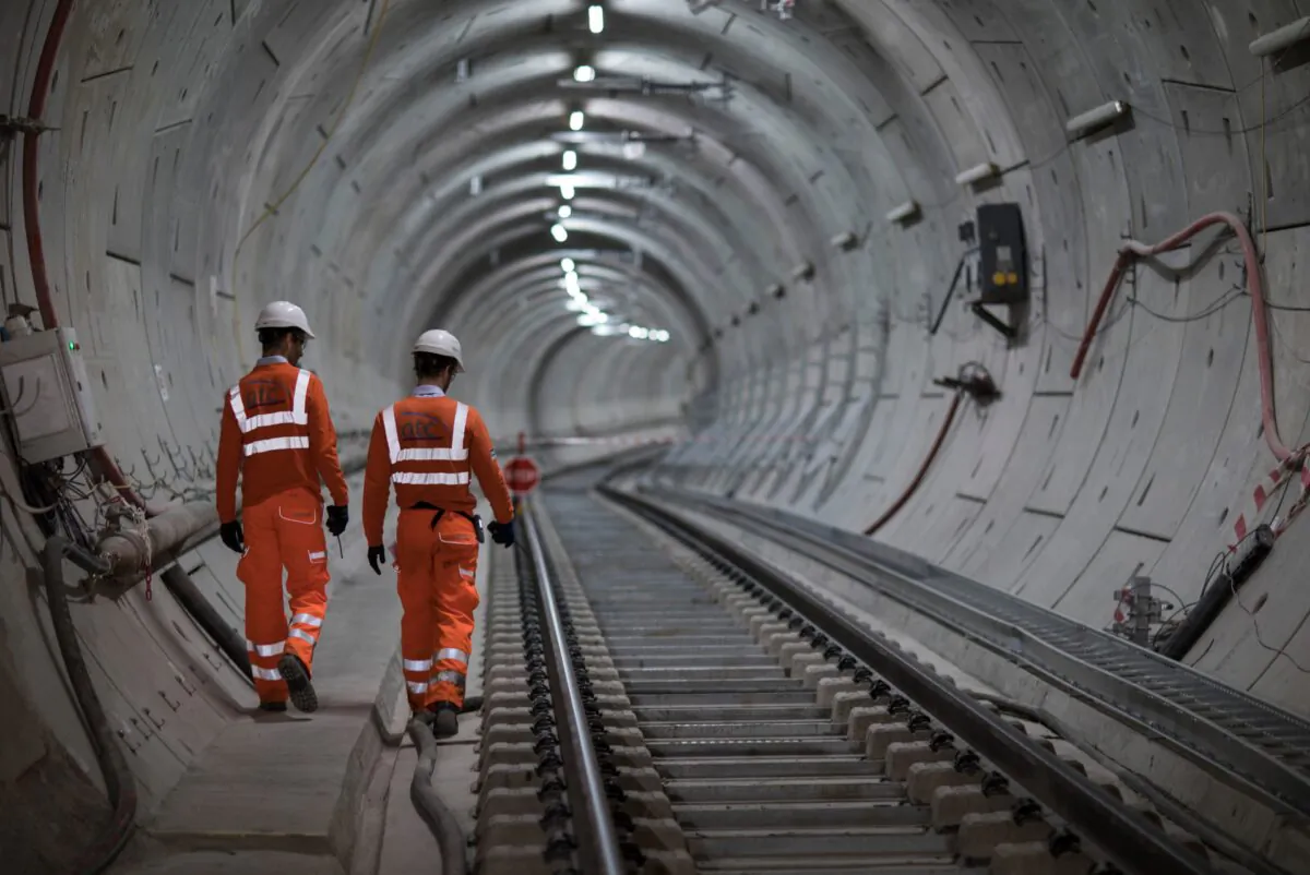 Crossrail engineers inspect the completed track as the Crossrail project celebrates the completion of the Elizabeth Line track, in London, on Sept. 14, 2017. (John Phillips/Getty Images)