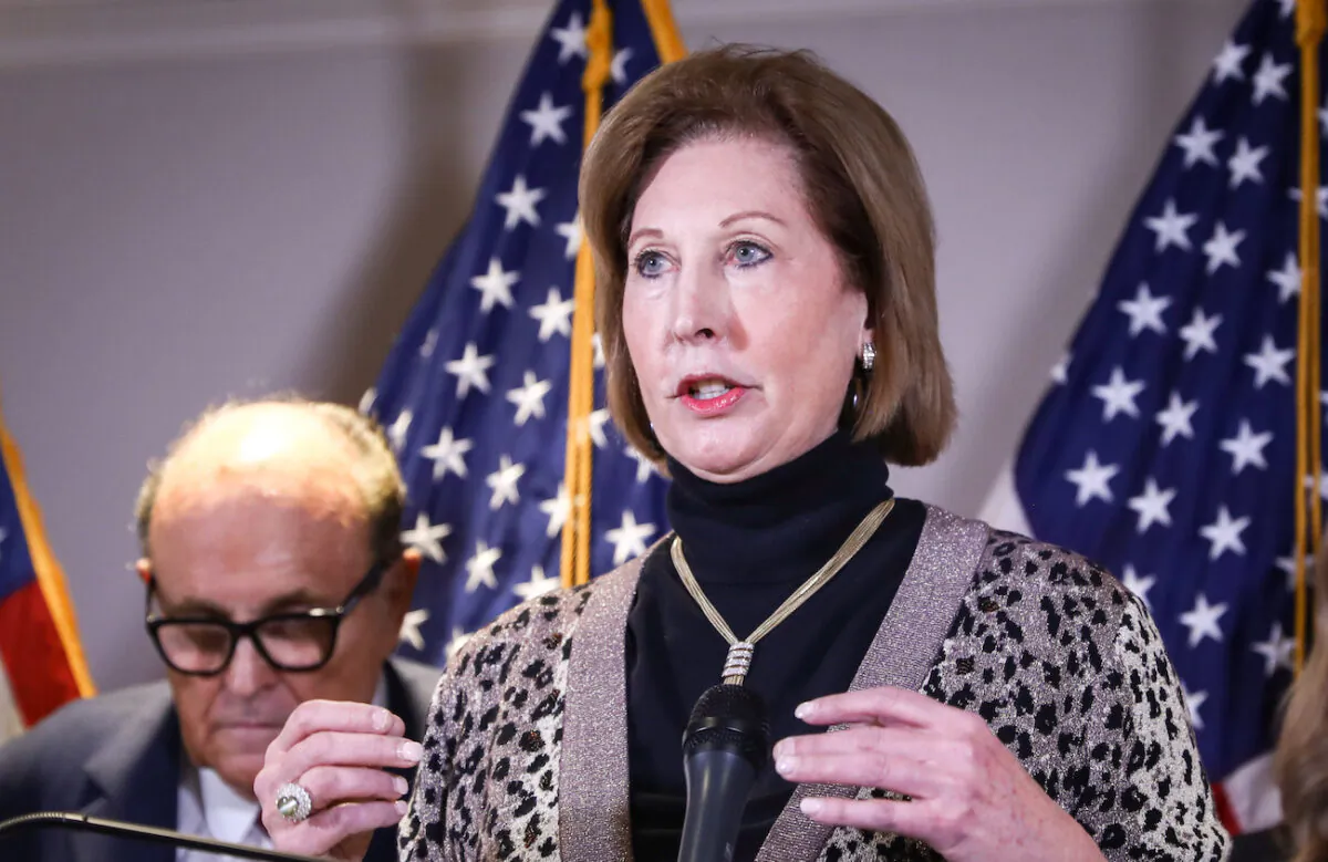 Attorney Sidney Powell speaks to media while flanked by Trump lawyer and former New York City Mayor Rudy Giuliani at a press conference at the Republican National Committee headquarters in Washington on Nov. 19, 2020. (Charlotte Cuthbertson/The Epoch Times)