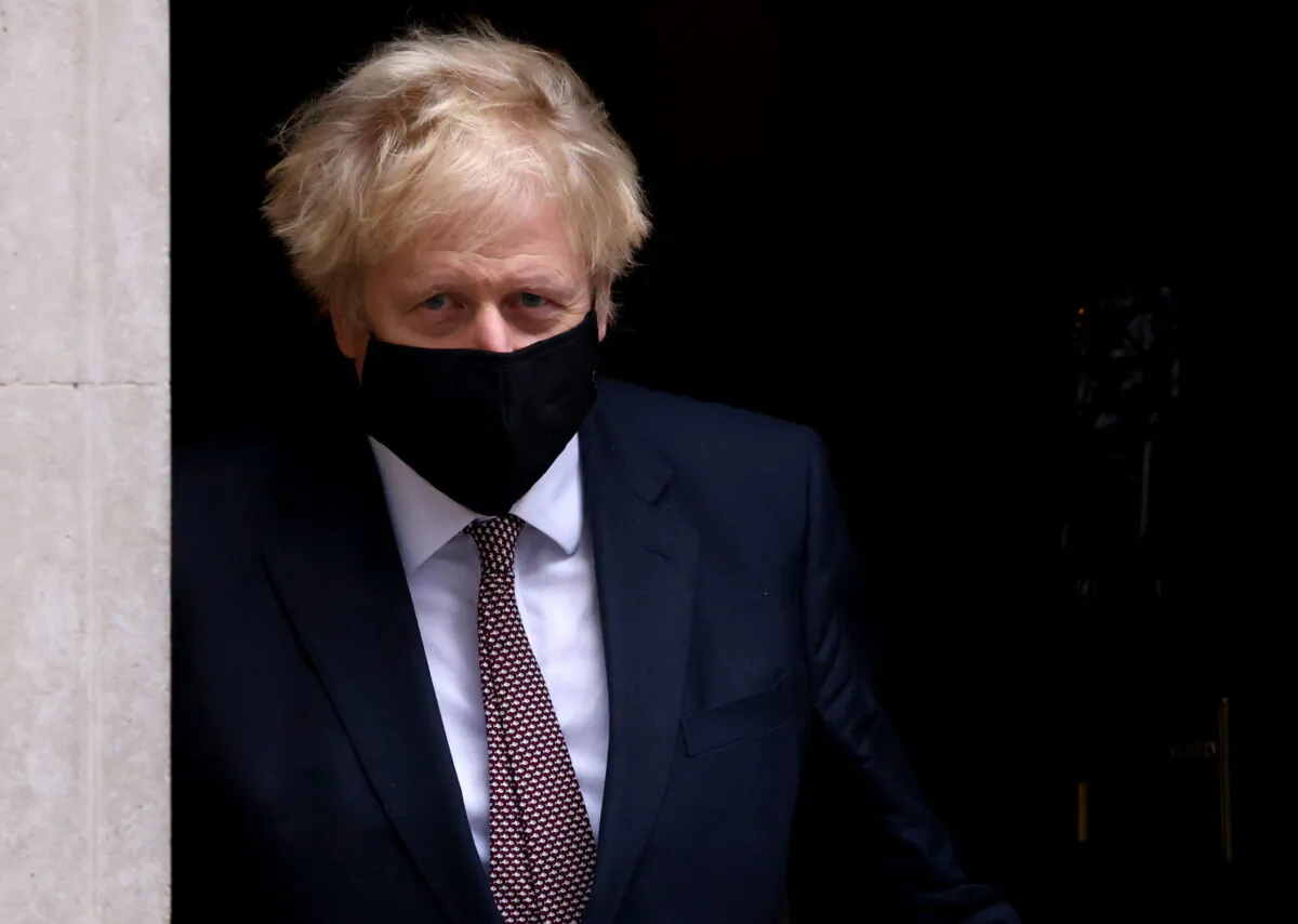 Britain's Prime Minister Boris Johnson seen in public for the first time since his self-isolation ended, leaves Downing Street during the CCP virus outbreak in London on Nov. 26, 2020. (Simon Dawson/Reuters)