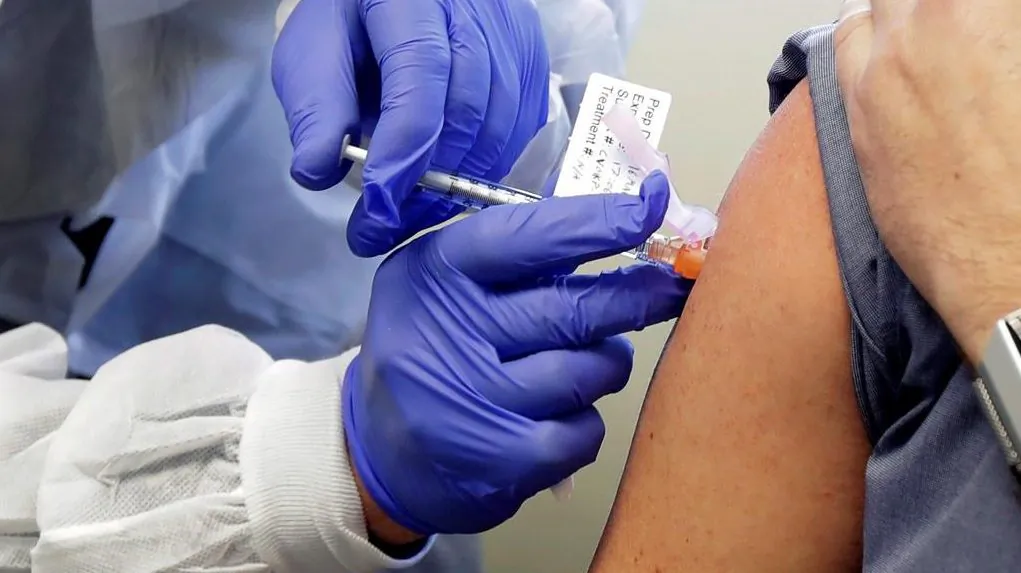 A patient receives a shot in the first-stage safety study clinical trial of a potential vaccine for COVID-19. (The Associated Press/Ted S. Warren)
