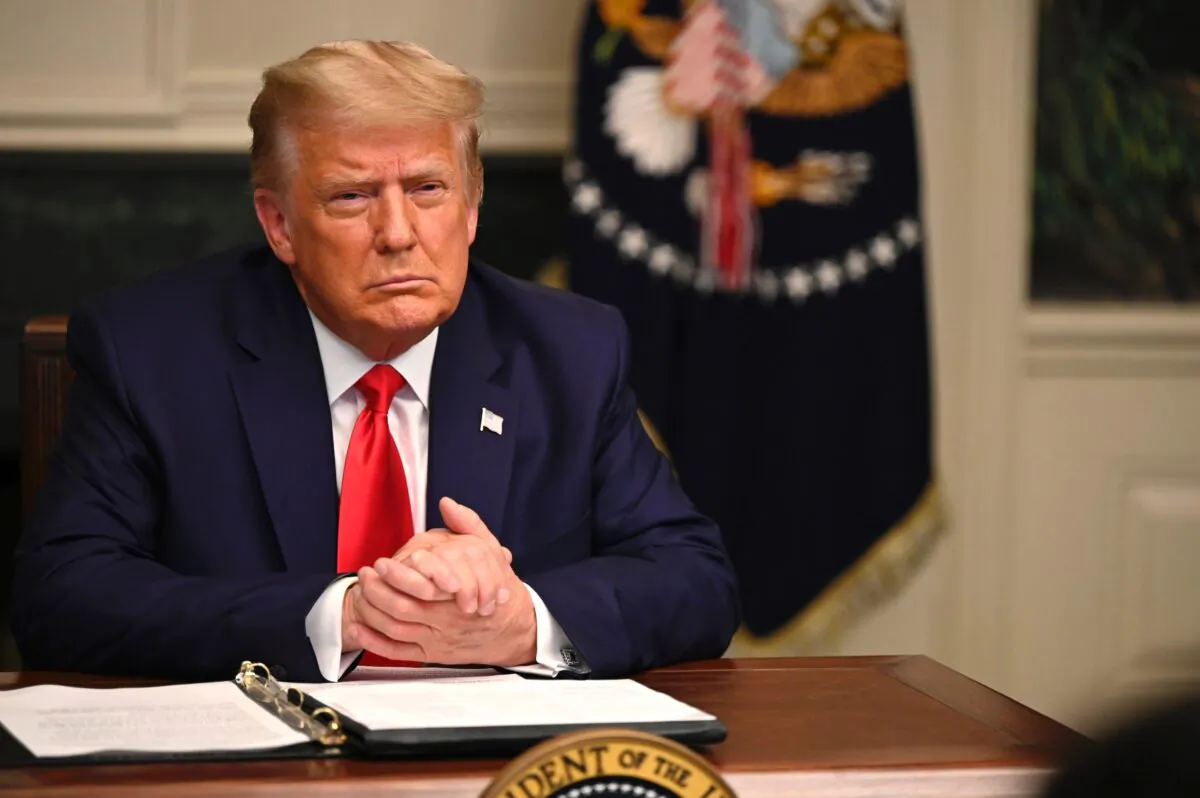 President Donald Trump participates in a Thanksgiving teleconference with members of the United States Military, at the White House in Washington, on Nov. 26, 2020. (Andrew Caballero-Reynolds/AFP via Getty Images)