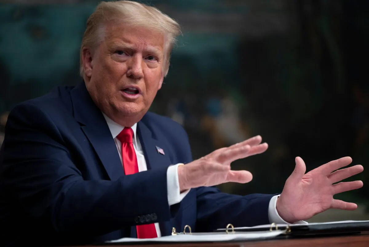 U.S. President Donald Trump speaks to reporters after participating in a Thanksgiving teleconference with members of the United States military, at the White House in Washington on Nov. 26, 2020. (Andrew Caballero-Reynolds/AFP via Getty Images)