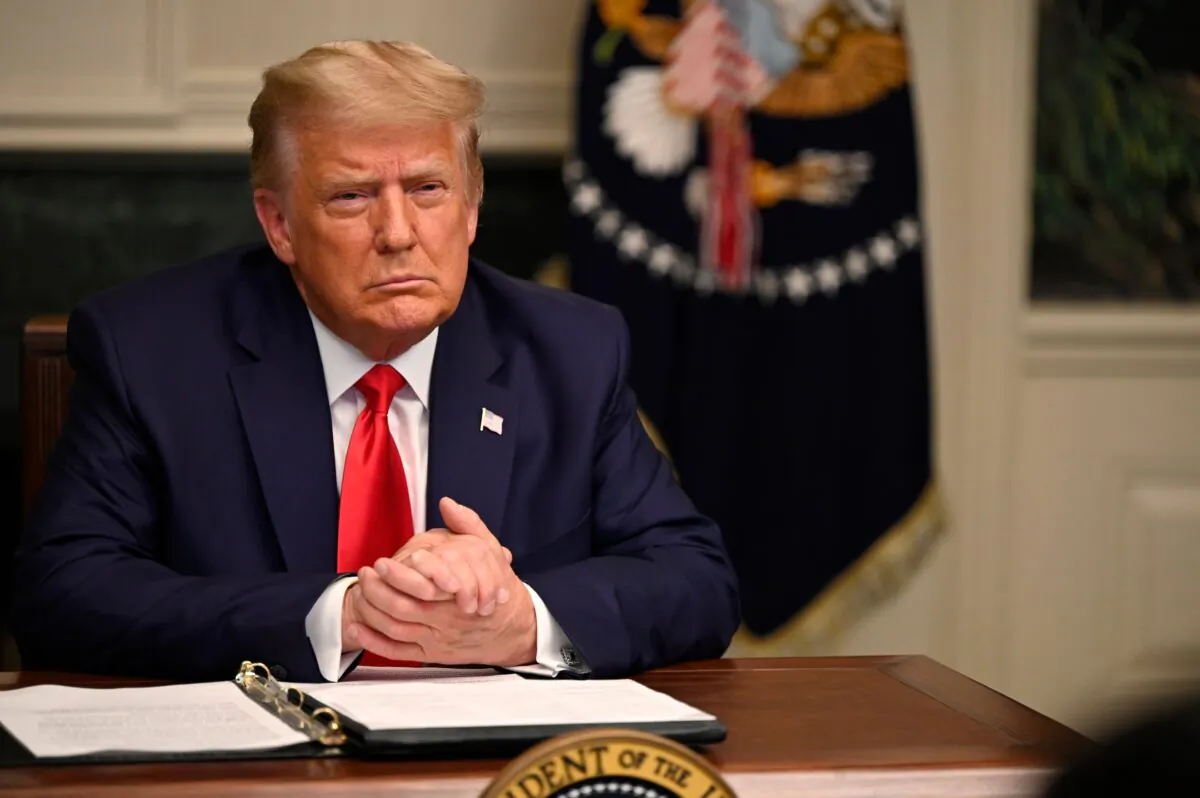 President Donald Trump participates in a Thanksgiving teleconference with members of the military at the White House in Washington on Nov. 26, 2020. (Andrew Caballero-Reynolds/AFP via Getty Images)