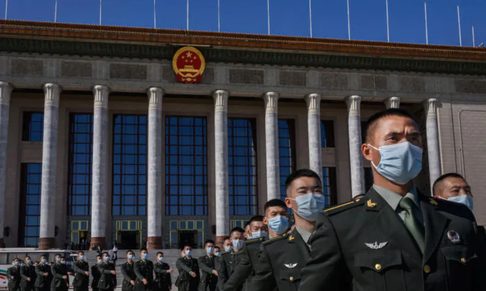 Soldiers with the People's Liberation Army march after a ceremony marking the 70th anniversary of China's entry into the Korean War, at the Great Hall of the People in Beijing on Oct. 23, 2020. (Kevin Frayer/Getty Images)