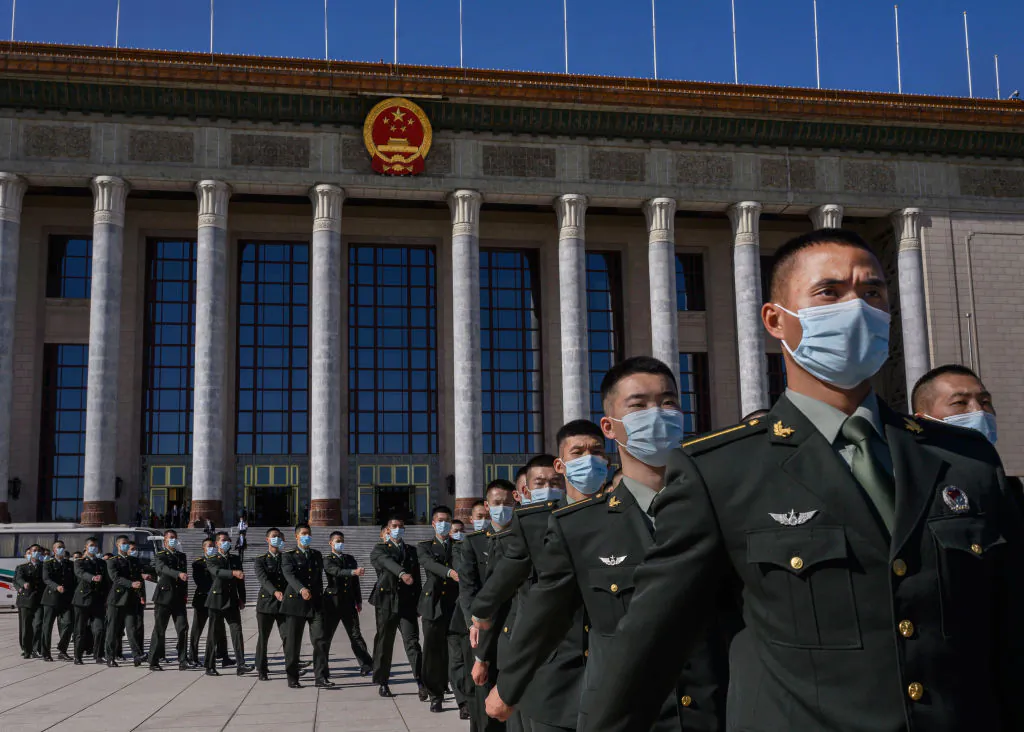 Soldiers with the People's Liberation Army march after a ceremony marking the 70th anniversary of China's entry into the Korean War, at the Great Hall of the People in Beijing on Oct. 23, 2020. (Kevin Frayer/Getty Images)