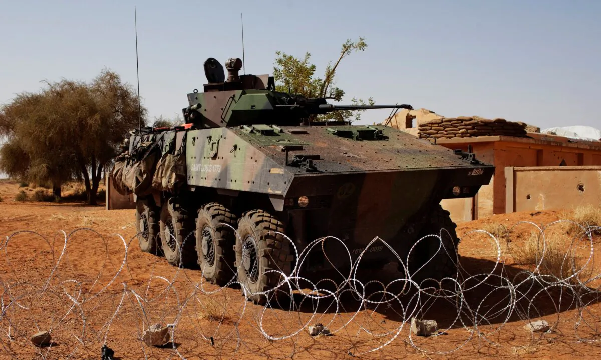 An armored vehicle is parked outside the French military base at the Malian airport in Gao, on March 9, 2013. (Joe Penney/Reuters)