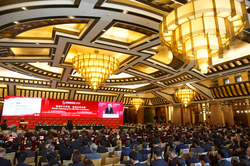 People attend the China Development Forum in Beijing on March 24, 2019. (Thomas Peter-Pool/Getty Images)