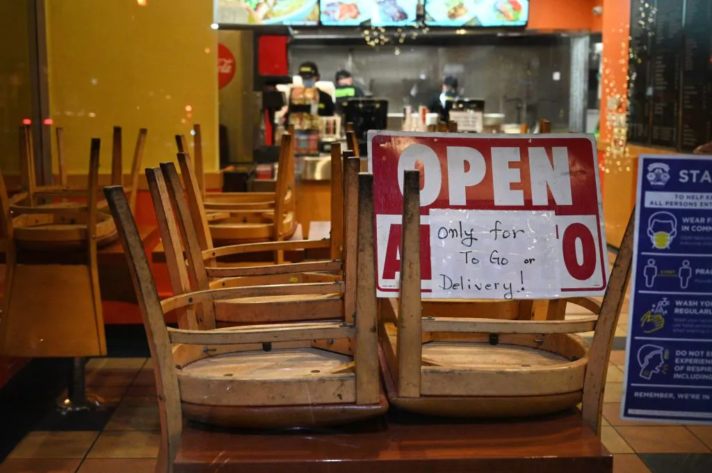 Employees work in a restaurant open for to-go or delivery orders only, in Burbank, Calif., on Nov. 23, 2020. (Robyn Beck/AFP via Getty Images)