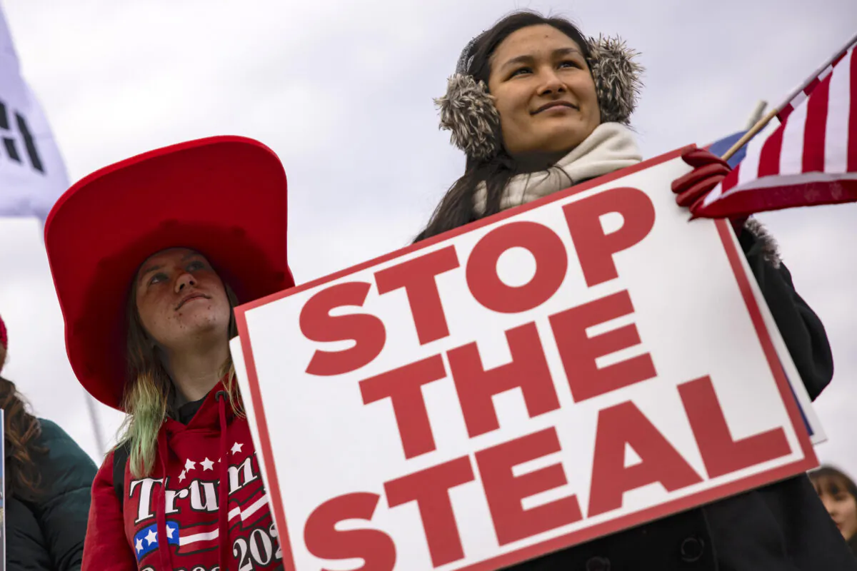 Supporters of President Donald Trump gather outside of the Wyndham Gettysburg hotel prior to a Pennsylvania Senate Majority Policy Committee public hearing on Nov. 25, 2020. (Samuel Corum/Getty Images)