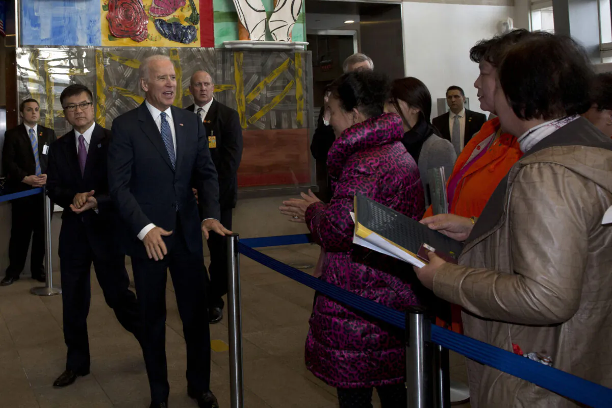 US Vice President Joe Biden meets visa applicants at the U.S. Embassy Consular Section in Beijing, China on Dec. 4, 2013. (NG HAN GUAN/AFP via Getty Images)