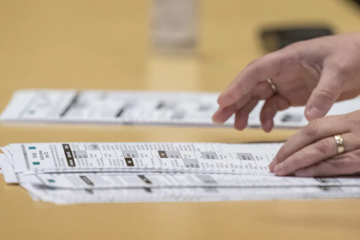 A election worker shows ballots to representatives for President Donald Trump during the presidential recount vote for Dane County, in Madison, Wis., on Nov. 20, 2020. (Andy Manis/Getty Images)