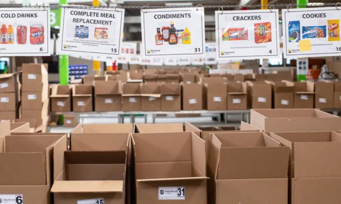 Boxes wait to be filled with provisions at The Daily Bread Food Bank warehouse in Toronto on March 18, 2020. (The Canadian Press/Chris Young)