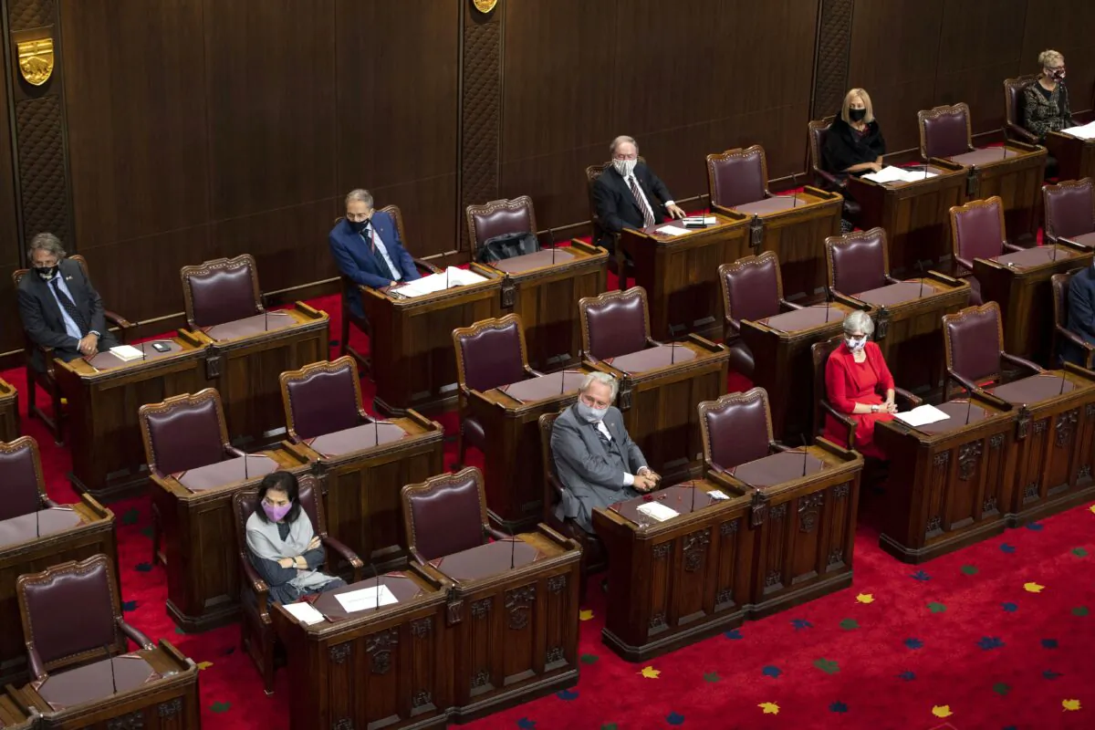 Senators sit physically distanced as they listen to Gov. Gen Julie Payette deliver the Speech from the Throne at the Senate of Canada Building in Ottawa, on Sept. 23, 2020. (Justin Tang/The Canadian Press)