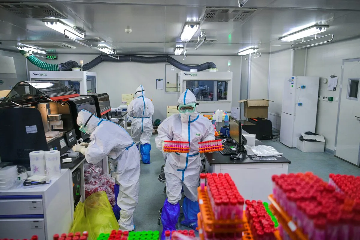Technicians are processing CCP virus tests at a laboratory in Tianjin, China on Nov. 23, 2020. (STR/CNS/AFP via Getty Images)