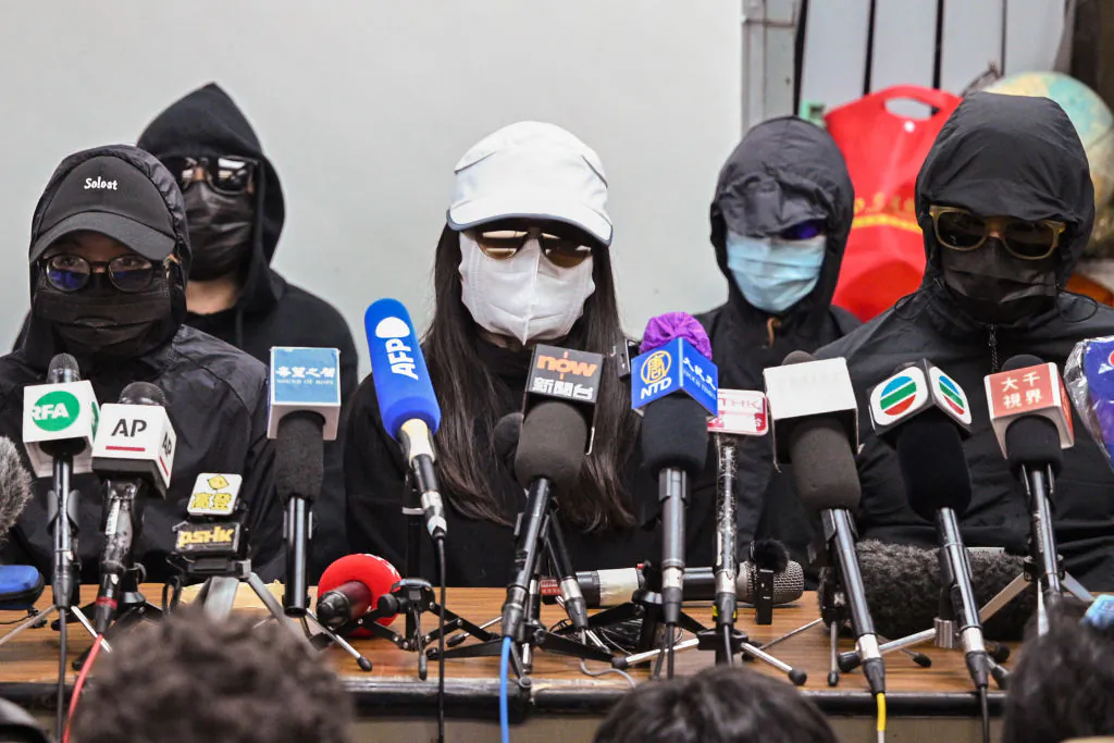 Family members of the "Hong Kong 12" hold a press conference in Hong Kong on Dec. 28, 2020. (Peter Parks/AFP via Getty Images)