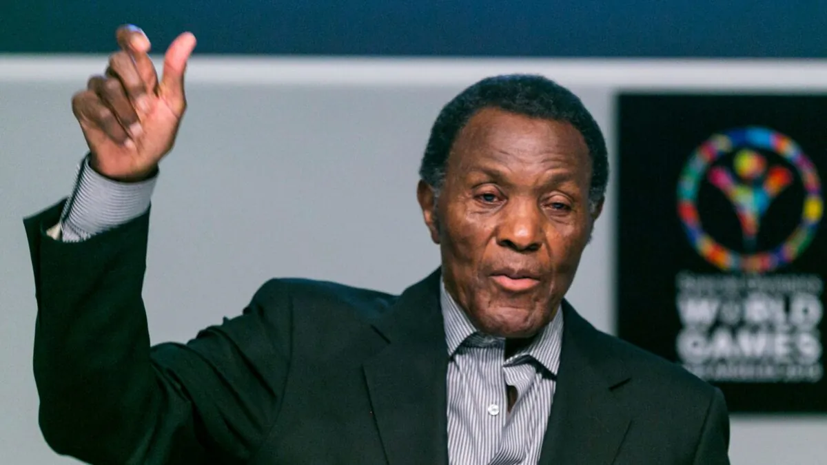 Olympic gold medalist and philanthropist Rafer Johnson lifts his arm to mimic the lighting of the Olympic torch as he recalls the first Special Olympics World Games he attended in Los Angeles, Calif., on July 20, 2015. (Damian Dovarganes/AP Photo)
