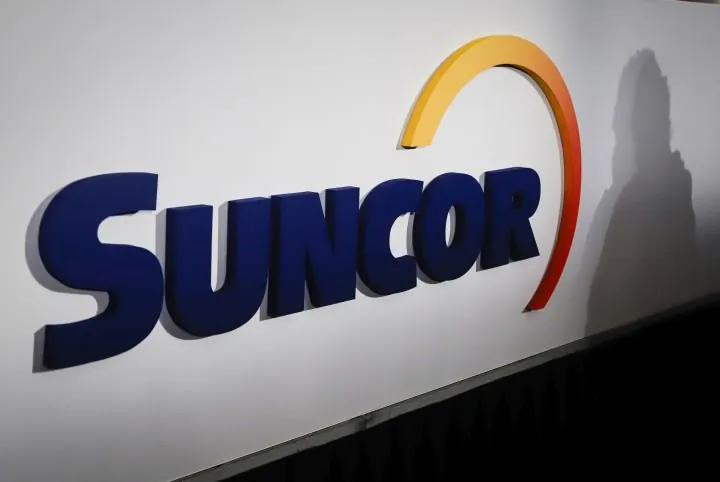 A Suncor logo is shown at the company's annual meeting in Calgary on May 2, 2019. (The Canadian Press/Jeff McIntosh)
