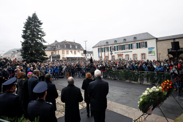 People gather to pay their respects