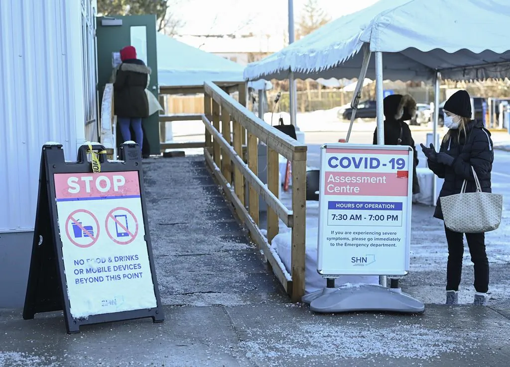 People line up at a COVID-19 assessment centre in Scarborough, Ont., on Dec. 2, 2020. (The Canadian Press/Nathan Denette)