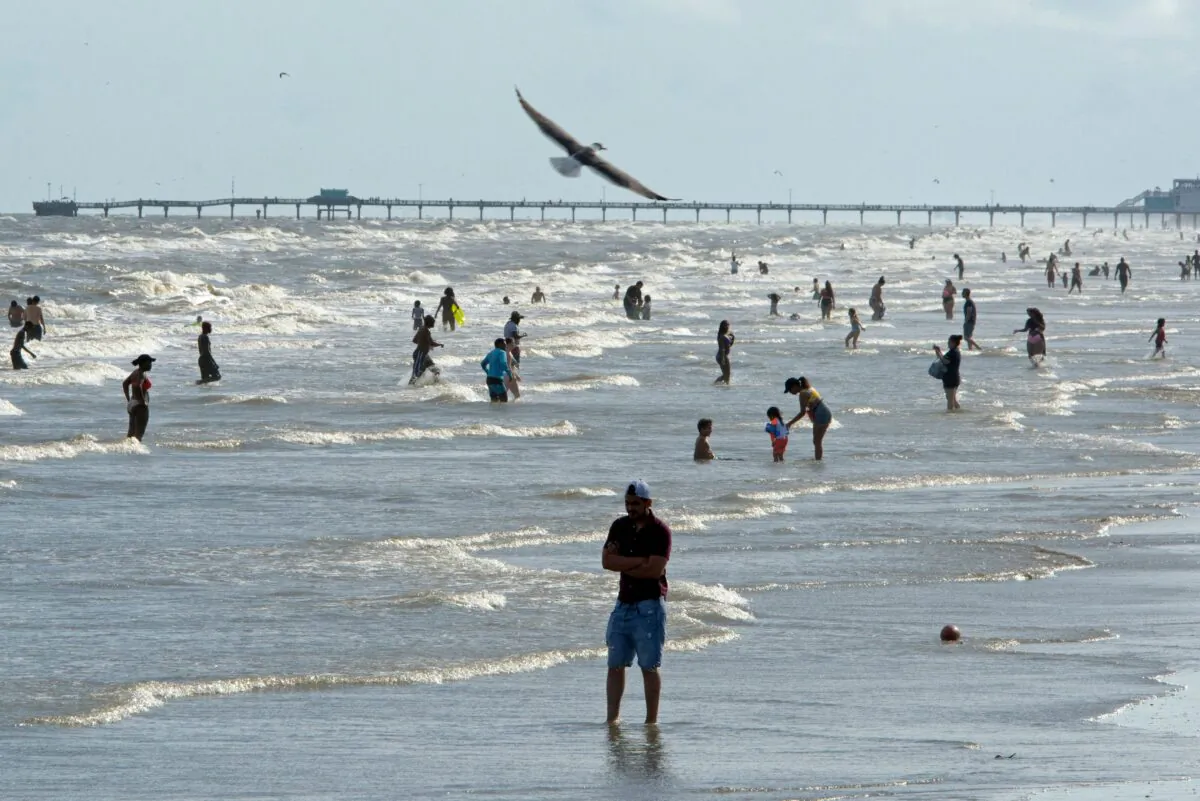 Beachgoers enjoy a day of sunshine in Galveston, Texas, on May 2, 2020. (Mark Felix/AFP/AFP via Getty Images)