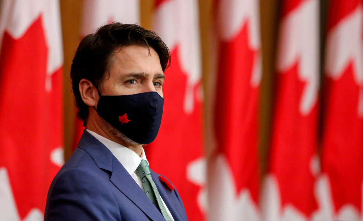 Canadian Prime Minister Justin Trudeau listens while wearing a mask at a news conference held to discuss the country's coronavirus disease (COVID-19) response in Ottawa, on Nov. 6, 2020. (Reuters/Patrick Doyle//File Photo)