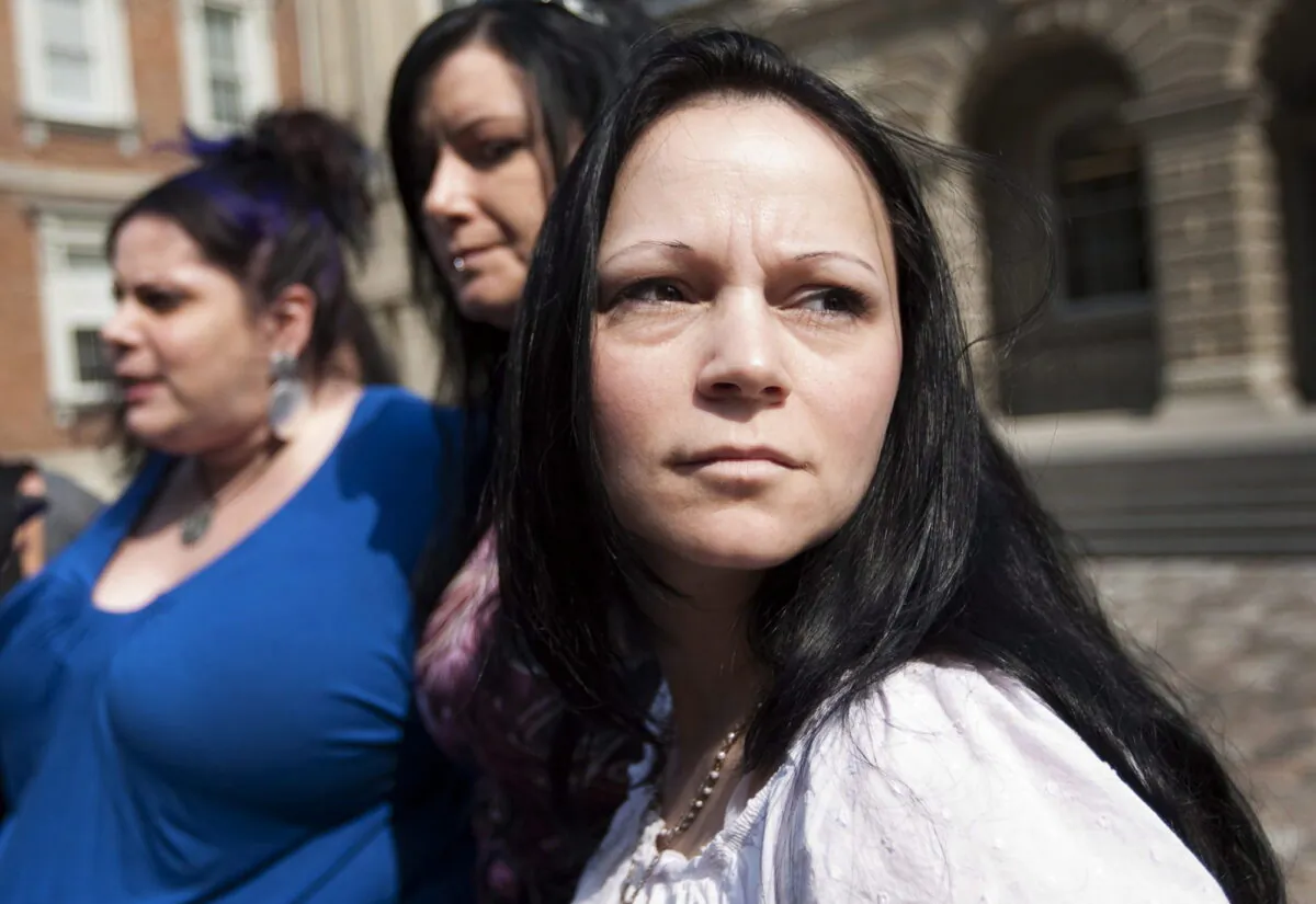 Timea Nagy (R), a former sex slave and victim of human trafficking, joins other former sex workers and activists against the legalization of prostitution while speaking to reporters outside the Court of Appeal for Ontario in Toronto, on June 17, 2011. (Darren Calabrese/The Canadian Press)