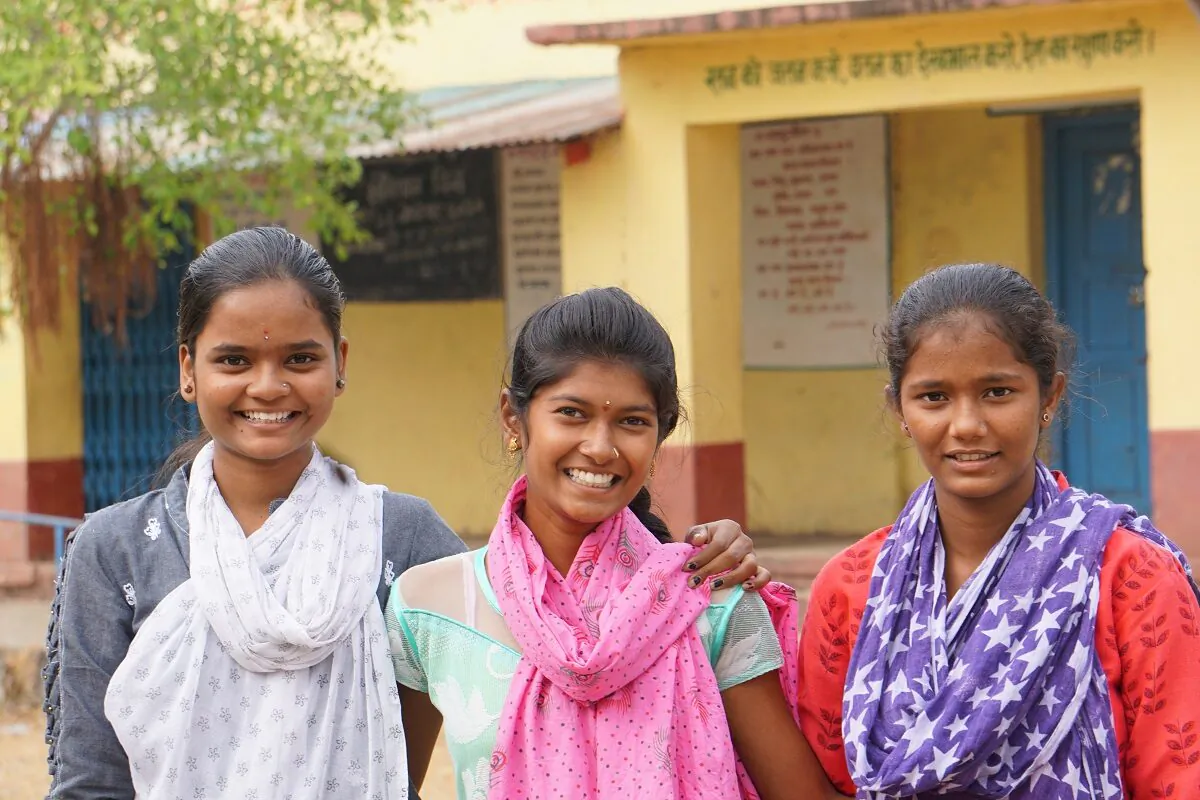 Bhagyshri, 16 (L), Mayari Pandhari Motiwad, 16 (C), and Aisha, 15 (R), at their school at Malhippangee, Maharashtra, India, on Nov. 27, 2020. Motiwad's parents were going to force her to marry during the COVID-19 lockdown, but the other two convinced her parents to let her continue her studies. (Venus Upadhayaya/Epoch Times)