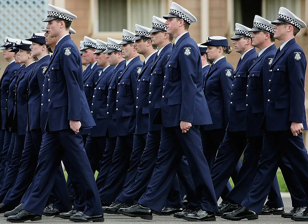 Police academy graduates from the Australian state of Victoria march during a graduation ceremony at the Victorian Police Academy on September 01, 2006 in Melbourne, Australia. (Quinn Rooney/Getty Images)